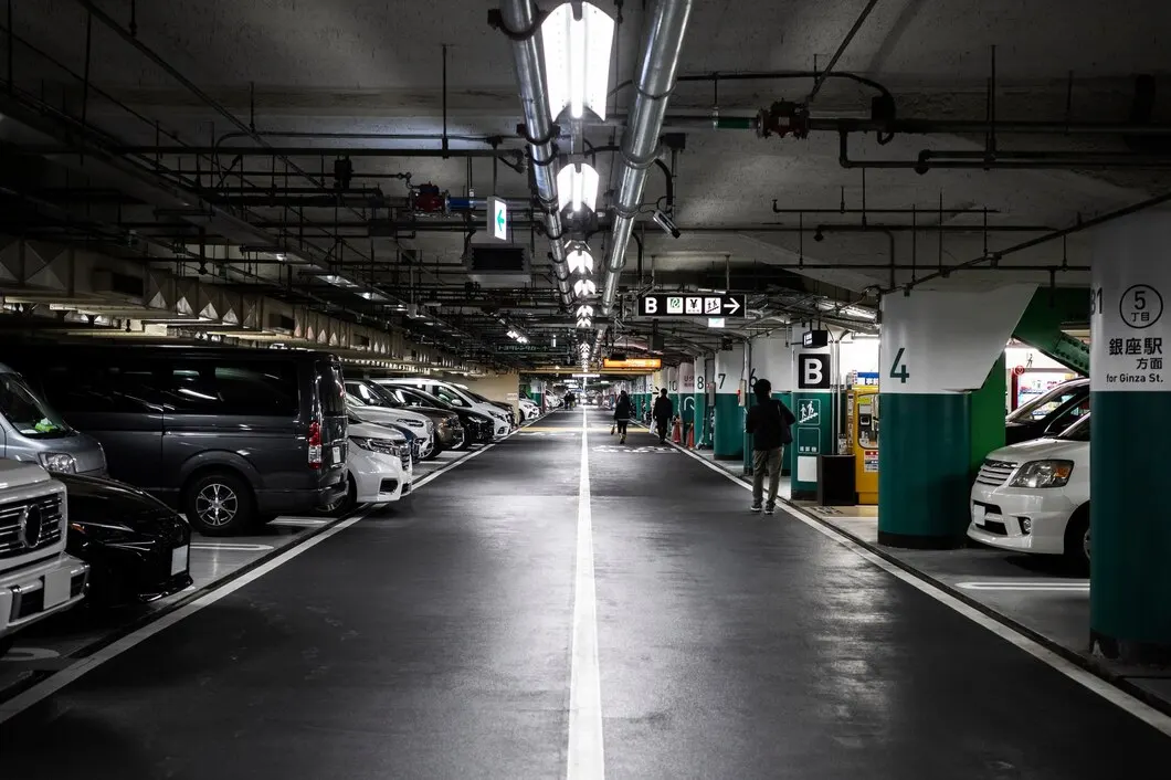 Well-lit underground parking garage with clear wayfinding